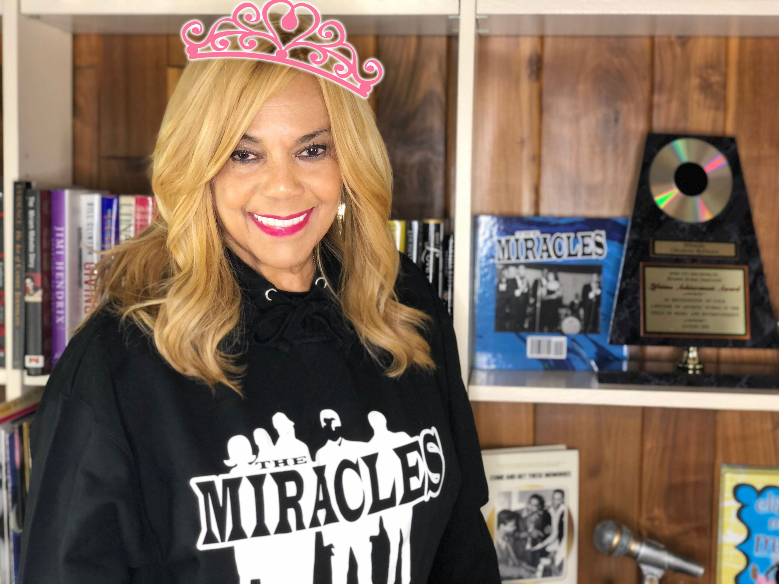 Claudette Robinson wearing a Miracles Sweatshirt